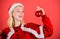 Christmas fun. Girl happy wear santa costume celebrate christmas hold ball decor red background. Christmas preparation