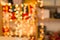 Christmas garland. Colorful Yellow Bokeh background of de focused glittering lights. Xmas background pattern concept.