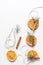 Christmas garland of dried oranges, pine twigs and cinnamon sticks strung on a string.