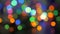 The Christmas garland is flashing with colored lights. Beautiful fuzzy background. Movement of the camera around the