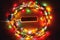 Christmas garland lights circle around electric extension cord