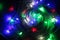 Christmas garland with multi colored bulbs and lights, Christmas, coloured small lights close up