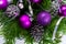 Christmas garland with silver glittercones and purple ornaments