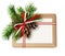 Christmas gift box with ribbon bow, fir-tree twig, cones and a c