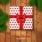 Christmas Gift Box Wrapping with Red Bow and Polka Dot Paper.