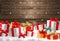 Christmas gifts boxes front of wood winter christmas background