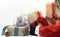 Christmas gifts from brown wrapping paper and with gift bow and santa claus placing gifts