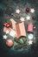 Christmas gifts decoration and making. Festive gift Cardboard boxes, ribbon, fir brunches, cookies and Gingerbread, scissors and C