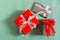Christmas gifts on a green background. Different packed boxes with tied bows top view