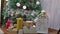 Christmas gifts interior tree and New Year room toys blinking lights and fireplace
