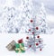 Christmas gifts under artificial tinsel tree outdoors with snowy mountain landscape background.  Actual photo shot in winter