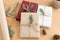 Christmas gifts on a wooden table with twine, scissors and wrapping paper