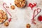 Christmas gingerbread background. Decorated red nosed reindeer cookies with chocolate buttons and melted chocolate.