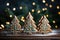 Christmas gingerbread cookies in the shape of Christmas trees. Gingerbread cookies against a background of festive golden bokeh.