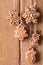 Christmas gingerbread hanging over wooden background