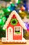 Christmas Gingerbread House On Background Of Christmas Tree With Burning Garlands Close Up