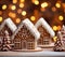 Christmas Gingerbread house on the background of golden festive bokeh.Christmas baking.Holiday mood