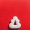 Christmas gingerbread in the shape of a Christmas tree on a red background, copy space