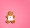 Christmas Gingerbread woman Cookie on a pink  background