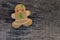 Christmas gingerbread woman on rustic wooden table