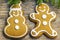 Christmas gingerbreads on a wooden table with fir branches