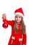 Christmas girl holding christmas tree toy in the hand, wearing a santa hat isolated over a white background
