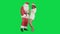 Christmas girl with santa claus dance on a Green