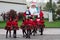 Christmas girls posing with Santa Claus