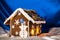 Christmas glazed gingerbread house with sugar snowman.