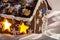 Christmas glazed gingerbread house with sugar snowman.