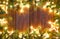 Christmas glowing stars and fir on wood