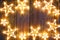 Christmas glowing stars on vintage wood