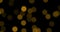 Christmas gold gradient sparkle glitter dust particles on black background with bokeh flowing movement, golden holiday happy new