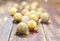 Christmas golden glittered balls on brown wooden background.