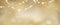 Christmas golden glowing background. Holiday abstract glitter defocused backdrop with blinking tars and garlands