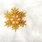 Christmas golden snowflake over white fur