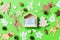 Christmas green background with holiday toys and decorations. Top view of wooden calendar. The twenty fifth of December. Merry