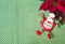 Christmas - green background, poinsettia, orange and funny chef Santa Claus