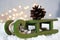 Christmas green sled carry pine cone, light star garland, vintage style, new year night composition