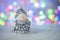 Christmas greeting card with decorative cute snowman. Bokeh effect on background