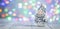 Christmas greeting card with decorative cute snowman. Bokeh effect on background. Horizontal banner