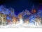 Christmas greeting card. Fabulous snow-covered town in the Christmas night. Highly realistic illustration