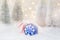 Christmas greeting card. Winter forest with frosty fir trees falling snow ornament ball candy cane golden garland bokeh lights