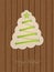 Christmas greeting with shoe lace tree and wooden background