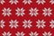 Christmas hand-knitted red snowflake seamless pattern. Winter sweater texture. Editable cozy realistic illustration.