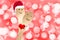 Christmas happy couple concept, smiley painted on spoons, holiday red background with blurred lights