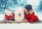 Christmas happy family, mother and son child walking with white Samoyed dog, lying on snow in winter day