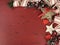 Christmas and Happy Holiday vintage background on dark red vintage recycled wood