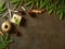 Christmas and Happy New Year dark background. Gift Christmas box, fir branches, concrete table, top view, copy space