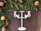 Christmas and happy New year. On a dark wooden background juicy spruce branches, glasses of champagne, candelabra, candle holder,